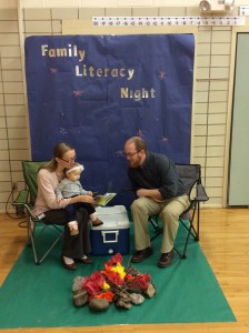 ELL teacher Mrs. Waters and her husband reading to daughter, Hannah.