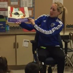 Whitney Sharpe from West Des Moines Soccer Club reading to a second grade classroom.